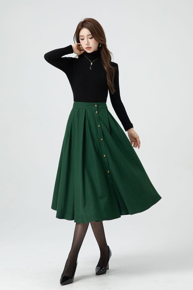 This green midi wool skirt has single-breasted design.  The attention to detail in the construction of this high waist circle skirt is evident in every stitch, show casing the craftsmanship and expertise that went into its creation.  DETAIL * 30% wool, 30% fiber, 40% polyester * Fully satiny lining, more nice to the touch body * Two side seam pockets * Front button closure, Button down skirt * Elastic waist at back, Plus size skirt * Midi wool skirt * Wool skirt women * High waist skirt, A Line skirt * For autumn and winter * Dry clean * Lean More about the items From the FAQs on the page bottom MODEL SIZE Bust 85 cm(33.4") Waist 67 cm(26.7") Height 168cm (5' 6") She wears size XS Choose CUSTOM Order if you * Need a better fit * Can't find your size in our size Chart * Change the Style * C Green Lined Midi Pleated Skirt, Chic Green Knee-length Pleated Skirt, Workwear Midi Skirt With Buttons, Green Lined Maxi Skirt For Work, Full Skirt With Buttons For Workwear, Green Pleated Skirt For Fall, Green Midi Skirt For Workwear, Knee-length Bottoms With Buttons For Winter, Green Midi Skirt For Fall