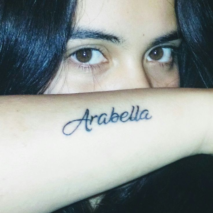 a close up of a person with a tattoo on their arm that says arabella