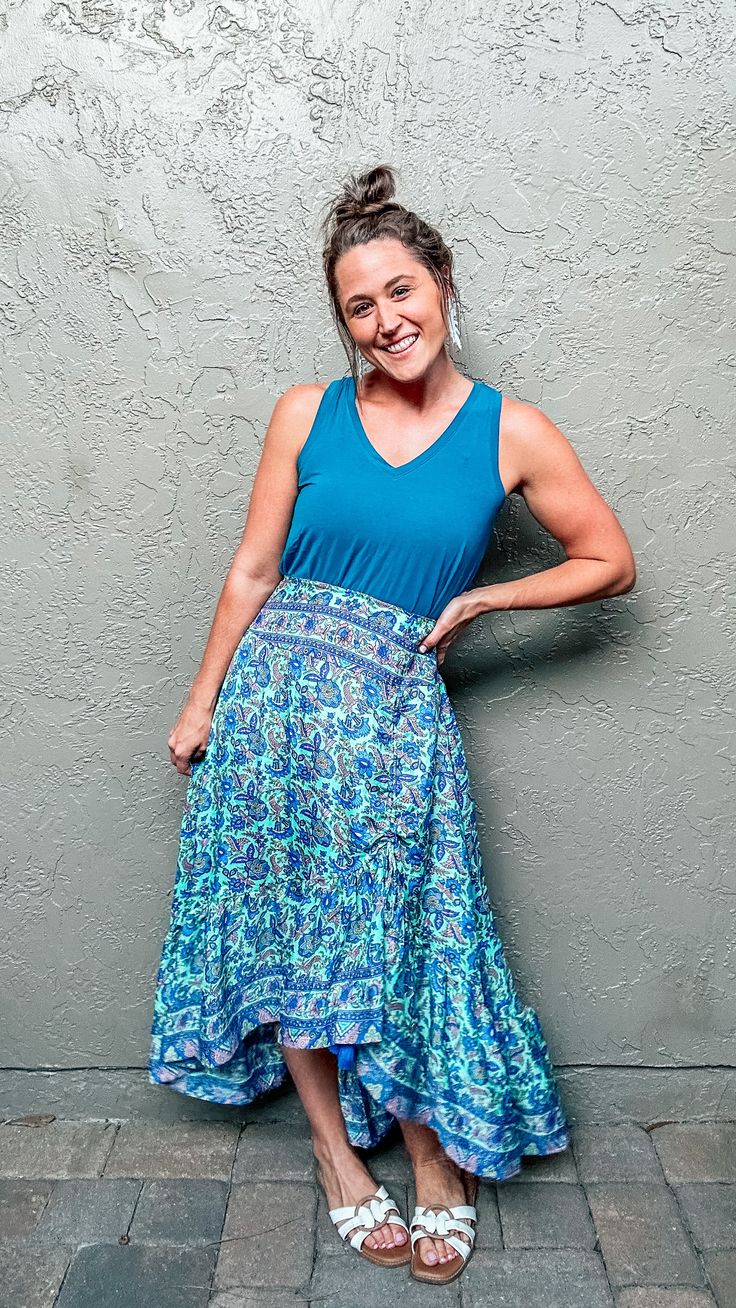 Show up to your next event feeling bold and confident in our Jasmine Boho Skirt! This beautiful skirt is perfect for date nights, beach vacations, or just running errands! With a vibrant blue floral paisley print with mint background and hints of purple, this maxi skirt will have you standing out from the crowd and feeing sexy! The flattering waistband and flowy fit will make you feel comfortable and stylish! You can easily pair this skirt with our Jasmine Boho Crop Top or a simple light blue sh Boho Crop Top, Mint Background, Boho Crop Tops, Boho Skirt, Beautiful Skirt, Beach Vacations, Light Blue Shirts, Date Nights, Boho Skirts