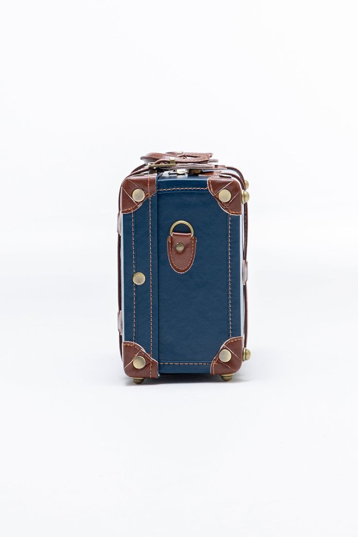 The perfect statement hand case or small cosmetic case, It's ideal for your in-flight essentials, beauty items, or the valuables you need to keep in hand. With shoulder and suitcase attachment straps, this hand case can also be carried as crossbody or secured to your rolling luggage for ease on the move. Blue Shoulder Bag Style Briefcase For Travel, Blue Everyday Rectangular Shoulder Bag, Blue Mobile Phone Shoulder Bag For Travel, Blue Travel Shoulder Bag For Mobile Phone, Blue Rectangular Box Bag For Daily Use, Blue Rectangular Travel Bag For Daily Use, Rectangular Box Bag With Detachable Strap For Travel, Rectangular Shoulder Bag For Travel, Travel Shoulder Box Bag