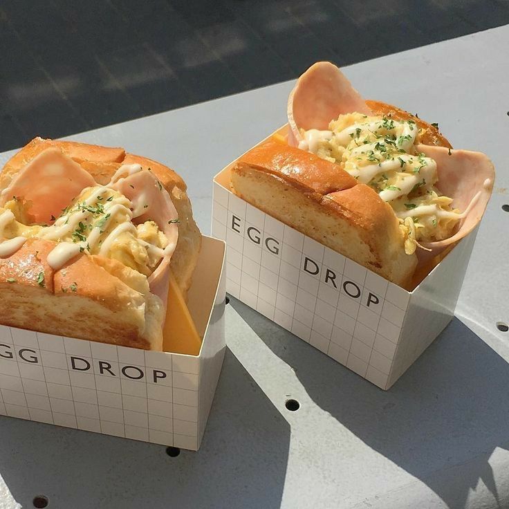 two boxes with food inside sitting on a table