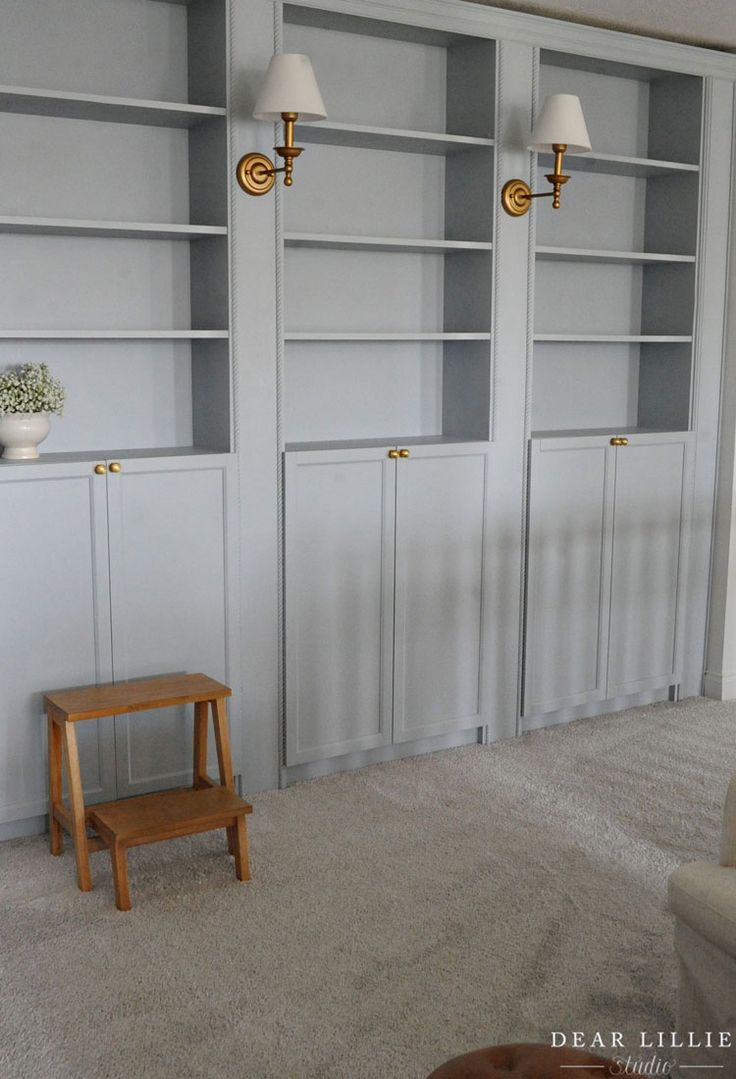 a living room filled with furniture and white walls