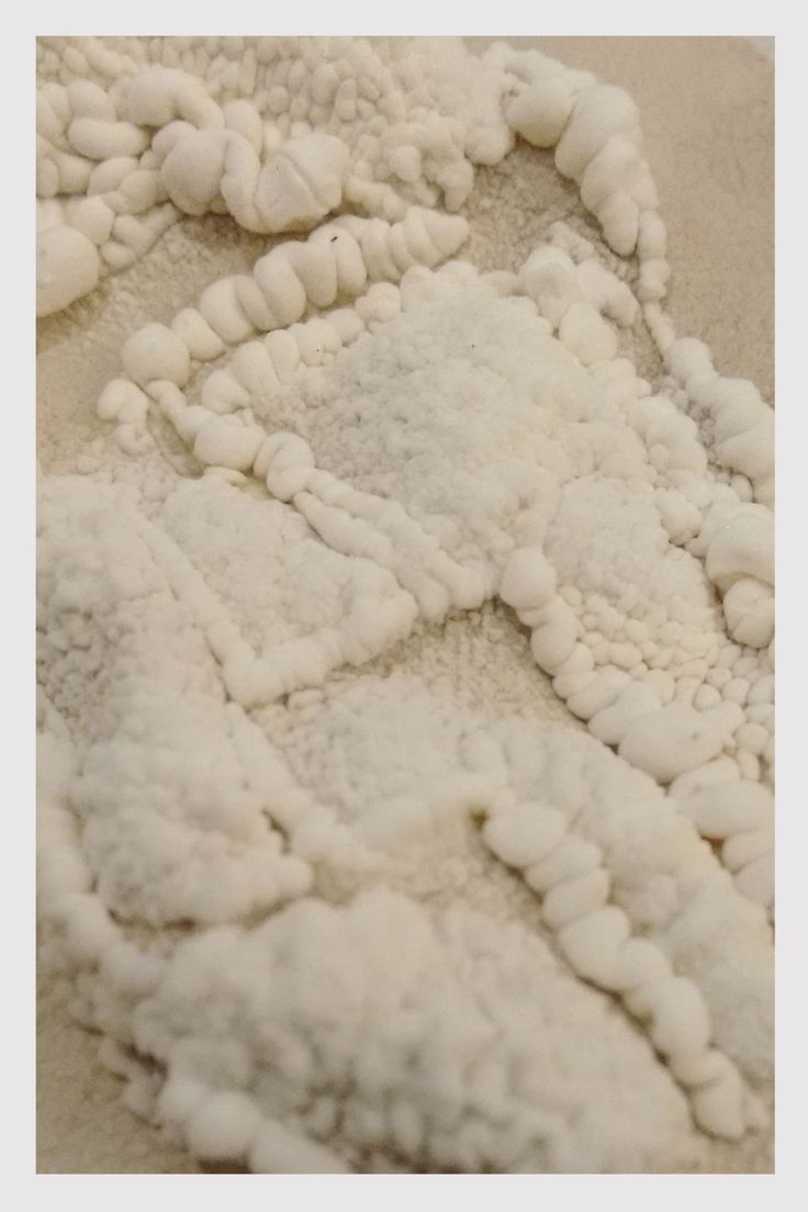 a pile of white stuff sitting on top of a floor