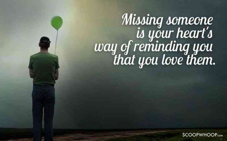 a man holding a green balloon with the words missing someone is your heart's way of remaining you that you love them