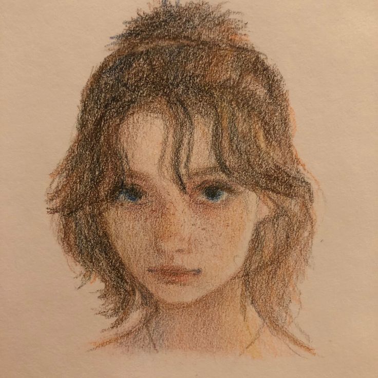 a pencil drawing of a woman's face with short brown hair and blue eyes