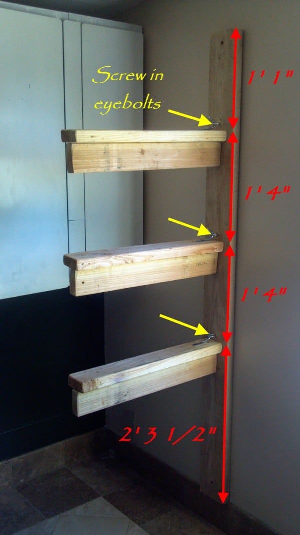 the height of some wooden shelves in a room with numbers on it and arrows pointing to them