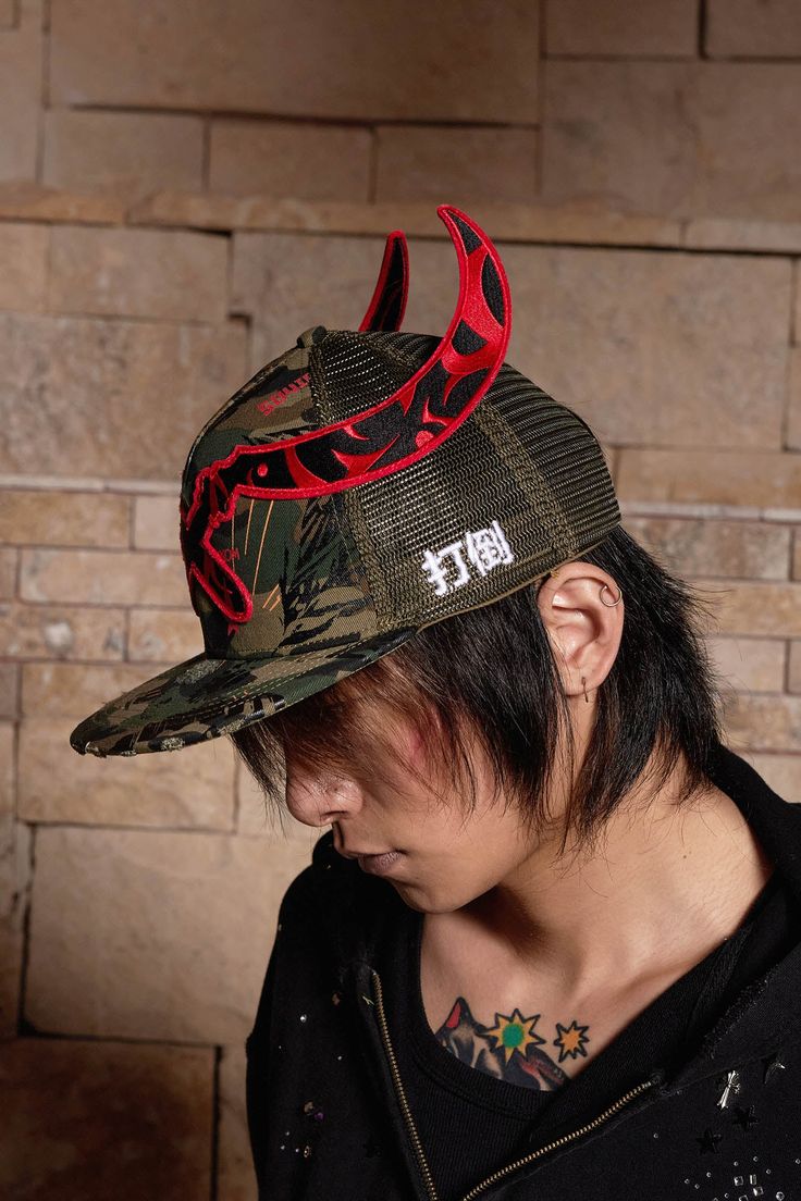 The Sickle Distressed Camo Baseball Cap expertly fuses street style with military-inspired elements, creating a bold and edgy accessory. The front of the cap features a stitched sickle, symbolizing strength and rebellion, while the left side is adorned with the Chinese characters "Knock down," adding a striking cultural touch. The cap is fully covered in a camouflage print, offering a rugged, tactical aesthetic. The back of the cap features a breathable mesh design, ensuring comfort during wear. Casual Camouflage Trucker Hat With Flat Brim, Military Style Hat For Streetwear, Military Camouflage Baseball Cap For Streetwear, Military Style Baseball Cap For Streetwear, Military Style Snapback Hat With Flat Brim, Military Style Snapback Hat For Streetwear, Punk Style Hat For Streetwear, Punk Style Hat For Streetwear, One Size Fits Most, Military Style Adjustable Snapback Trucker Hat