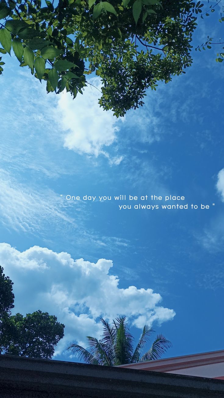 the sky is blue with white clouds and green leaves on it, as well as an inspirational quote that reads always believe in something