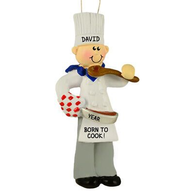 a christmas ornament that is shaped like a chef holding a pan and spatula