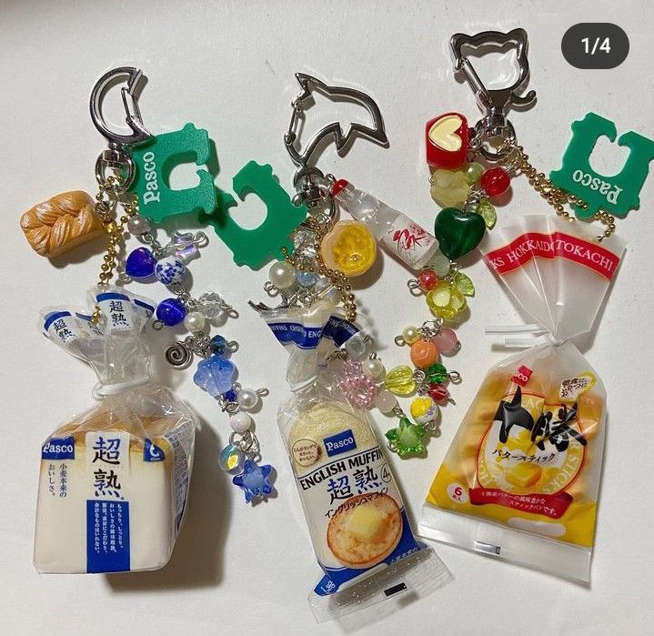 several keychains with various items on them including milk, cookies and other things