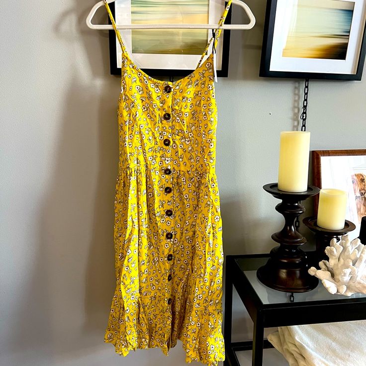 Beautiful Sundress Button Front Smocking In Back Adjustable Spaghetti Straps Ruffle Bottom I Would Where This For Brunch Or Any Day With Espadrilles And A Floppy Hat Yellow Cotton Button-up Dress, Yellow Button-up Cotton Dress, Yellow Knee-length Casual Sundress, Yellow Casual Knee-length Sundress, Spring Vacation Sundress With Button Closure, Casual Yellow Knee-length Sundress, Yellow Daywear Dress With Button Closure, Summer Sundress With Button Closure, Yellow Knee-length Buttoned Dress