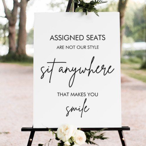 a sign that says, assigned seats are not our style stay anywhere that makes you smile