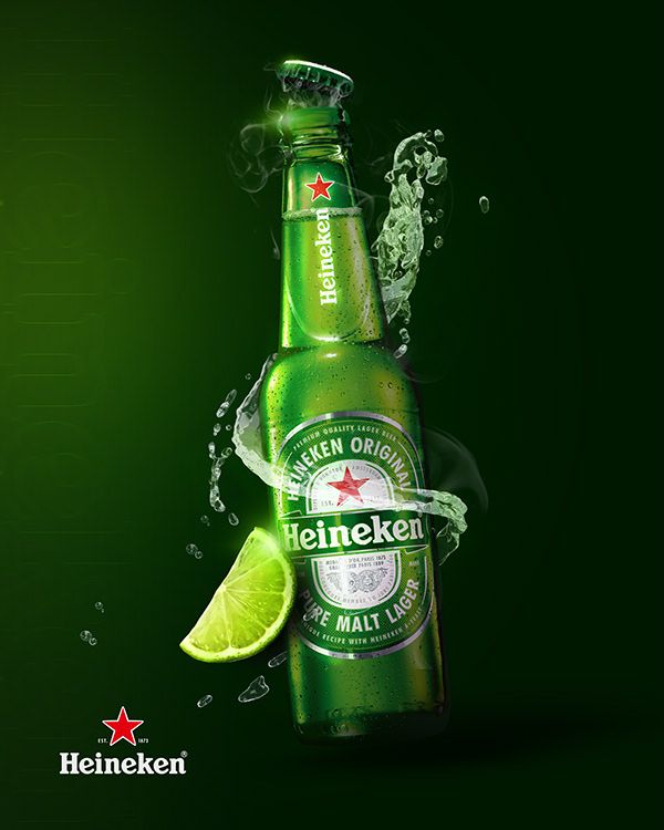 an advertisement for heineken beer with lime and water splashing around it