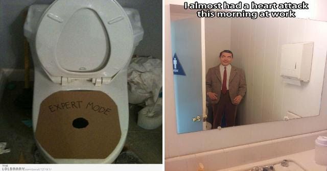 a man standing in front of a bathroom mirror next to a toilet with the lid up