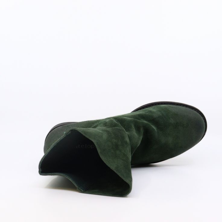 These slouchy ankle boots are all about effortless style with that soft, quality suede that feels like a dream. Features a trendy green suede with a distressed finish for that perfectly lived-in, don’t-care vibe. Slip these on, and you're ready for anything—whether it's a casual coffee run or a day of conquering city streets. Plus, that slouchy fit adds a little extra edge while keeping things ultra-comfy. Green Slouchy Boots, Bohemian Suede Slip-on Boots, Green Suede-lined Round Toe Boots, Lace-up Suede Boots With Vibram Sole, Green Leather Sole Slip-on Boots, Slouchy Ankle Boots, Green Suede, Heels & Wedges, Top Gifts