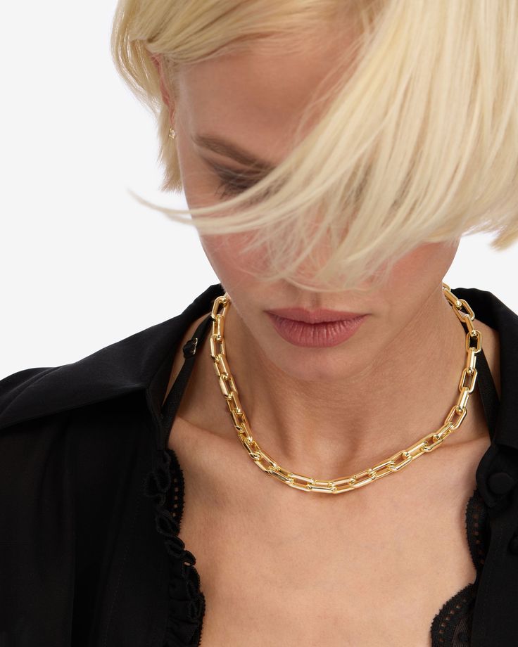 Being bold never goes out of style. Sleek, substantial, and dripping with confidence, the Lil Frankie Chain Necklace is designed for those who love making a statement without shouting. Whether you're dressing up for a night out or adding a touch of edge to your everyday look, this necklace has got you covered. DETAILS: Chain Link Necklace Length: 16" Link Size: 8mm x 15mm x 3mm Signature MM Padlock Clasp SKU: N6383 MATERIALS: 18k Gold Plated Over Brass Gold Choker Jewelry For Night Out, Choker Chain Jewelry For Night Out, Gold Jewelry With Adjustable Chain For Night Out, Elegant Link Chain Choker, Party Chain Choker Necklace, Luxury Gold-tone Chain Necklace For Party, Elegant Chain Link Choker For Party, Party Choker Chain Necklace, Elegant Formal Necklace With Chain Strap