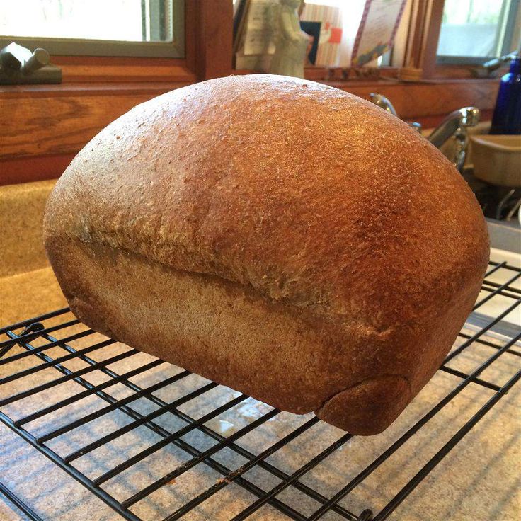 a loaf of bread sitting on top of a cooling rack