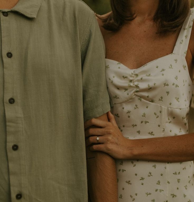 a man and woman standing next to each other