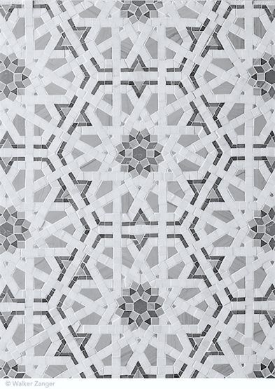 an intricately designed wall with brown and white tiles