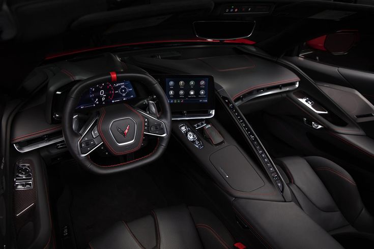 the interior of a sports car with red stitching and black leather trimmings