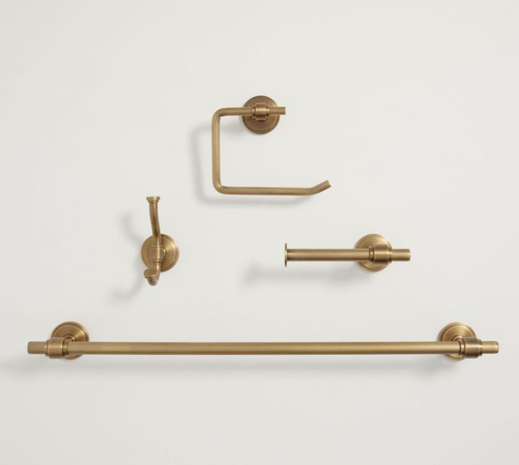 brass bathroom accessories set on white background