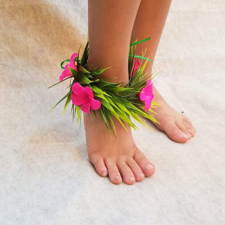 a barefoot woman's bare feet with pink flowers