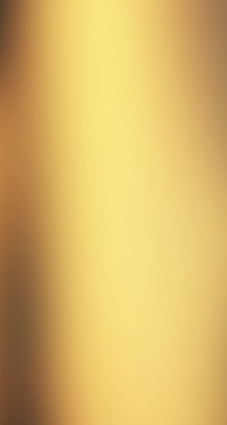 a blurry image of an orange and yellow background with the light reflecting off it's side