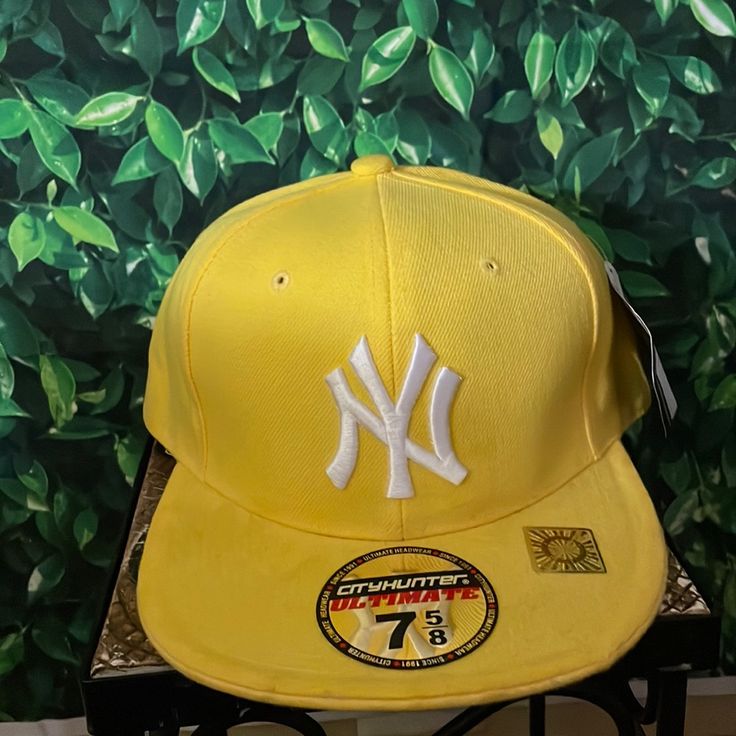 Yellow And White Fitted Hat Size 7 5/8 Condition New Gold Casual Baseball Cap, One Size Fits Most, Gold Casual Baseball Cap, One Size, Casual Gold Baseball Cap One Size, Gold Casual Baseball Cap One Size, Gold Casual Baseball Cap For Streetwear, Yellow Adjustable Visor Snapback Hat, Casual Gold Cap, Yellow Sports Hat With Curved Brim, Yellow Snapback Sports Hat