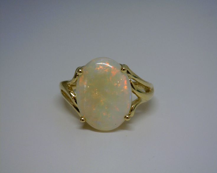 14K YELLOW GOLD OPAL RING 4.75 CT Formal Yellow Gold Round Opal Ring, Formal Yellow Gold Opal Ring, Gold Opal Ring Stamped 14k, Oval Gold Opal Ring In 14k Gold, Gold Classic Opal Ring For Formal Occasions, Formal 14k Yellow Gold Opal Ring, Formal Gold Opal Ring Stamped 14k, 14k Yellow Gold Opal Ring For Anniversary, Heirloom Gold Opal Ring Stamped 14k