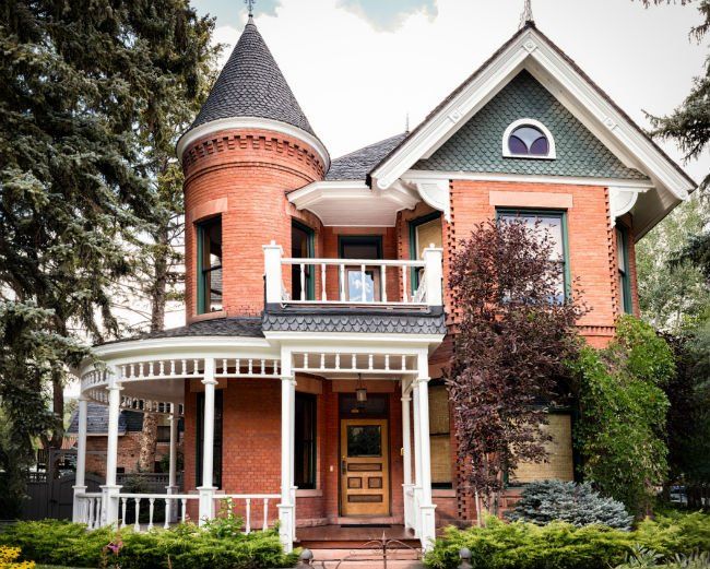 a large red brick house with a turret