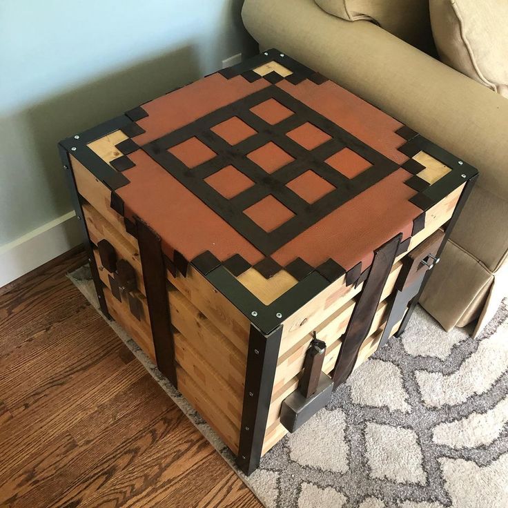 a table made out of wooden crates sitting on top of a rug next to a couch