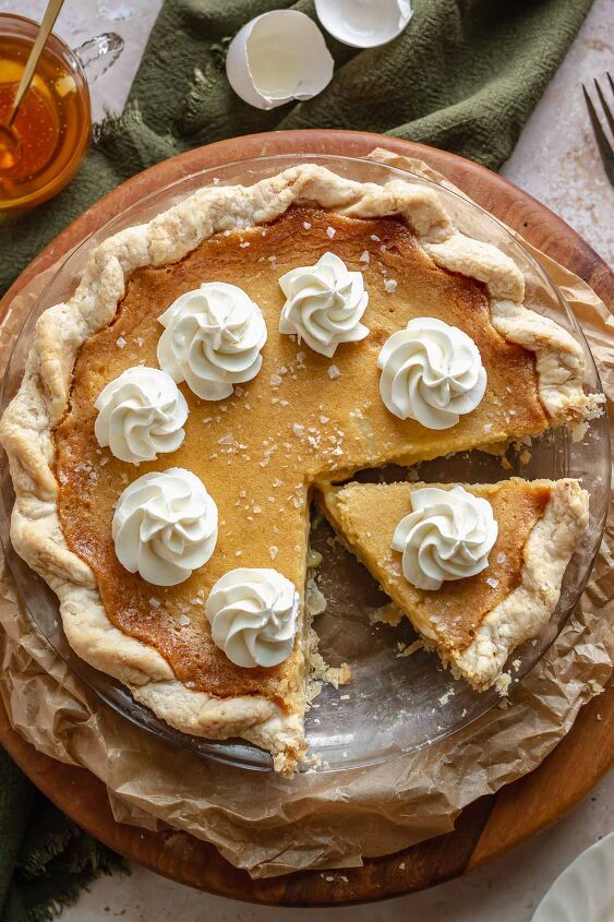 there is a pie with white icing on it