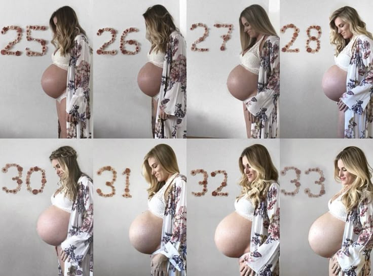 the pregnant woman is posing for pictures with her belly in front of them and numbers on the wall behind her