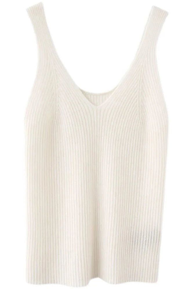 Stay cozy and stylish in this wool knitted vest with a V-neck design. Perfect for layering over camisoles or shirts, it adds a chic touch to your outfits. Details: Elasticity: High Stretch Fabric Type: Woolen Material: wool Size (IN) Bust Length M 31.50 21.26 L 33.07 21.65 XL 34.65 22.05 Ribbed V-neck Knit Top For Layering, Chic V-neck Knit Top For Layering, Trendy Ribbed V-neck Sweater Vest, White Ribbed V-neck Sweater, Chic V-neck Fine Knit Tank Top, Spring Ribbed V-neck Vest, Trendy V-neck Ribbed Sweater Vest, White Fine Knit V-neck Top, V-neck Knit Top For Layering