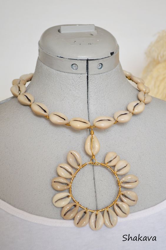 Handmade Shell Necklaces For Vacation, Handmade Gold Bohemian Shell, Beaded Cowrie Shell Strand Jewelry, Handmade Bohemian Gold Shell, Handmade Shell Necklace For Summer, Unique Shell Necklace For Festival, Unique Shell-shaped Necklace For Festivals, Handmade Shell-shaped Necklace For Beach, Summer Festival Cowrie Shell Jewelry