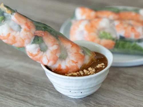 shrimp sticks with dipping sauce in a small bowl