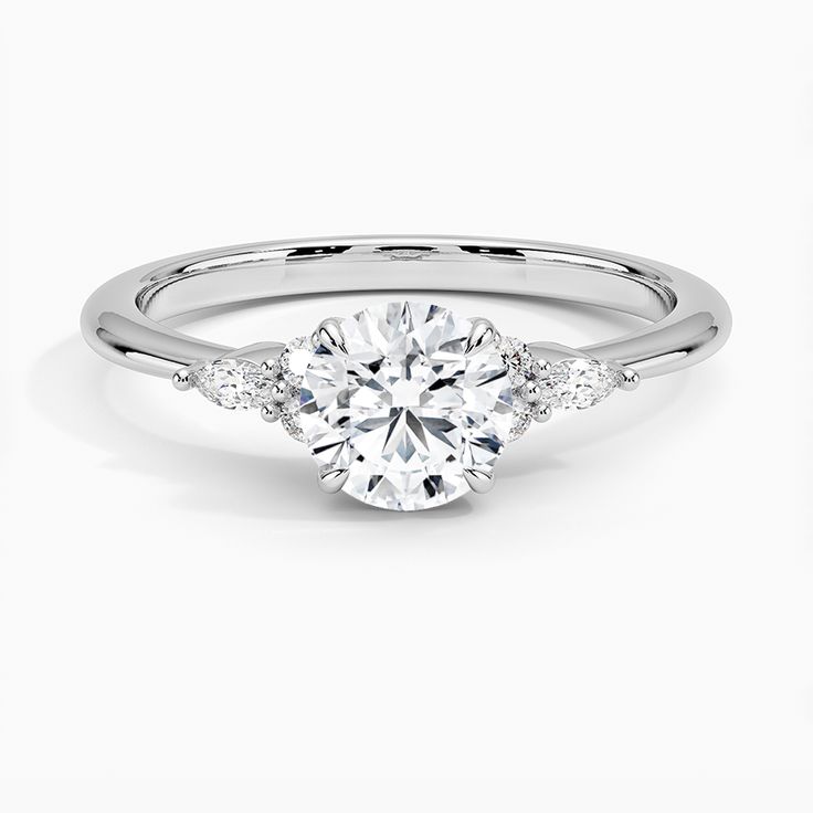 a white gold engagement ring with three stones