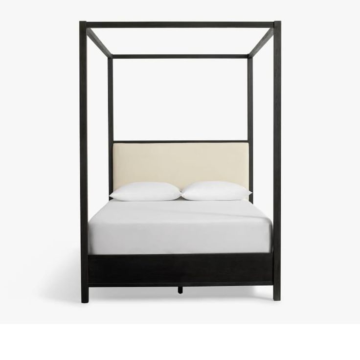 a bed with a canopy and pillows on top of the headboard, in front of a white background