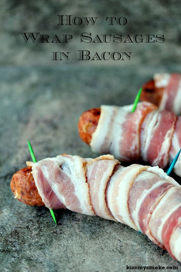 bacon wrapped sausages in bacon on toothpicks