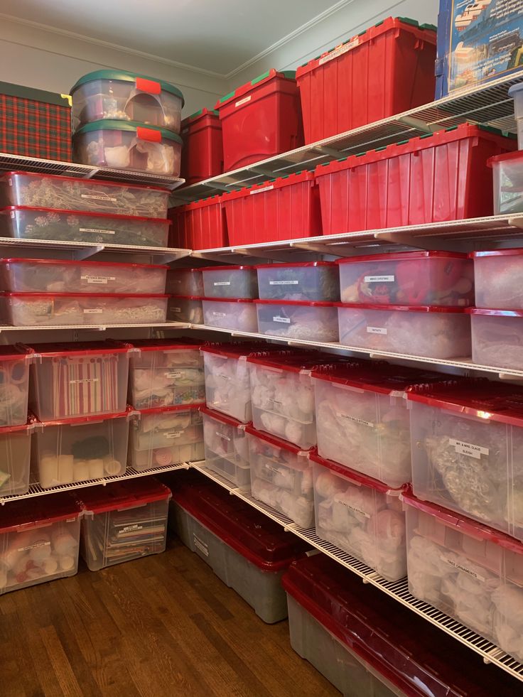 the shelves are filled with plastic containers and bins