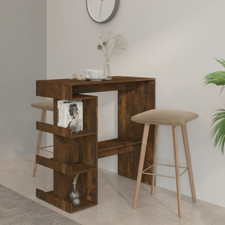 a table with stools and a clock on the wall