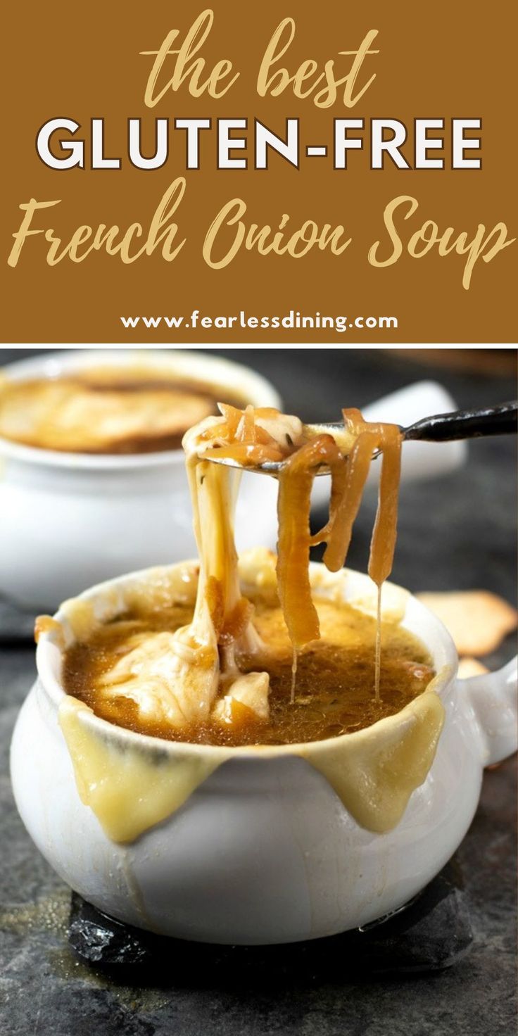 the best gluten - free french onion soup in a white bowl with cheese being drizzled over it