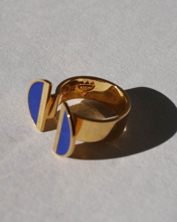 Indulge in elegance with our 24K Gold Vermeil Split Top Crescent Lapis Enamel Ring, a captivating piece from the Diasporan Voyage Collection. Crafted in collaboration with Chee Lee Designs, this ring features a unique split top design in 24K Gold Vermeil , adorned with lustrous crescents in lapis enamel. This ring is a statement of modern style interwoven with the rich tapestry of African heritage. Experience the fusion of luxury and cultural significance with this timeless addition to your jewelry collection. Lapis blue enamel 24K Vermiel Don't see your size? Don't worry these can be made to order. Email us at marcheruedix@gmail.com for inquires. Crescent Ring, Split Top, African Heritage, Lapis Blue, Enamel Ring, Top Design, Gold Vermeil, Don't Worry, Crescent