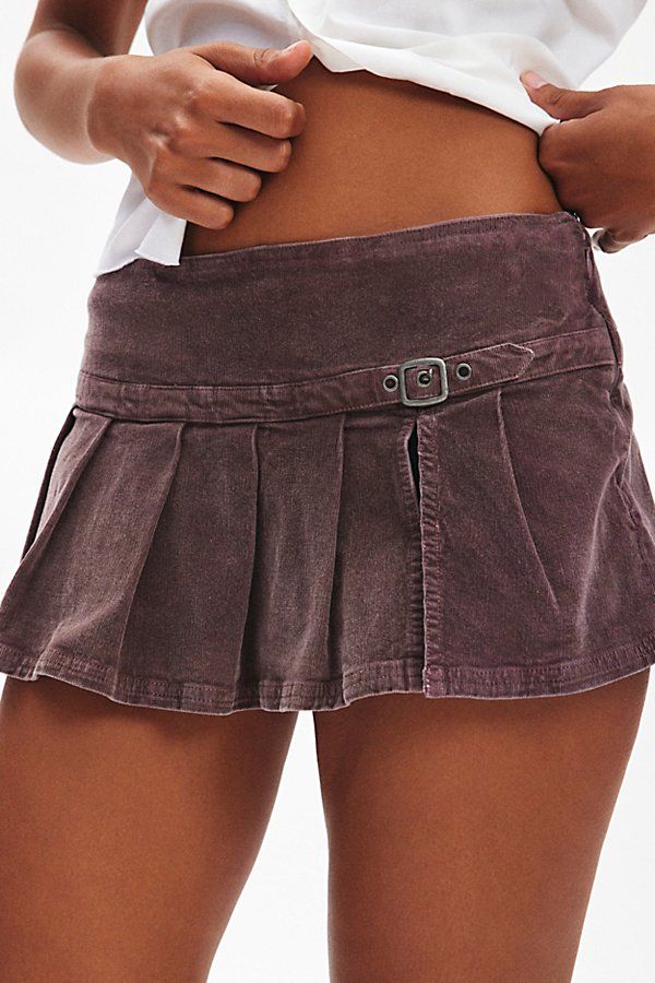 Our best-selling Shaina pleated micro mini skort now in ultra-soft corduroy. Designed with Y2K details like a buckled low rise with a dropped waist that flares out into a pleated, micro mini skirt. Only at Urban Outfitters. Features Ecote Shaina corduroy pleated micro mini skort Low-rise mini skort in soft corduroy Drop waist skirt style Belted with box pleats Micro mini length Built-in shorts lining Zip closure UO exclusive Content + Care 98% Cotton, 2% spandex Machine wash Imported Size + Fit Pleated Jean Mini Skirt, Coquette Skirts, Funky Skirts, Mini Skirt Aesthetic, Going Out Skirt, Corduroy Skirt Outfit, Mini Skirt Fits, Purple Mini Skirt, Flare Mini Skirt