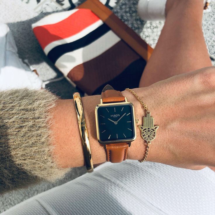 Elevate your everyday style with the Hurtig Lane Neliö Women's Vegan Leather Square Watch in Gold, Black & Tan Brown A fashionable and eco-conscious accessory that exudes sophistication. Expertly crafted with ethical, cruelty-free vegan leather and a durable stainless steel case, this elegant watch combines a minimalistic, square design with exceptional quality. The Neliö's sleek dial and versatile vegan leather strap make it a perfect accessory for any outfit, while its reliable quartz movement Gold Office Watch With Leather Strap, Trendy Gold Watch Accessories With Leather Strap, Timeless Gold Leather Watch Accessories, Gold Watch With Leather Strap, Gold Watch Brown Leather Strap, Oliver And Co, Vegan Store, Espadrilles Men, Vegan Bags