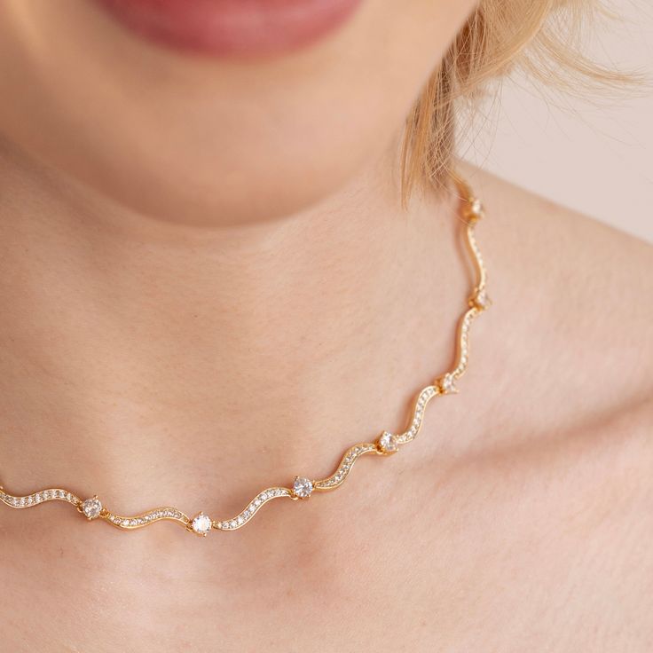 Delicate and unique, this stunning necklace is a perfect piece to compliment any fit. 18K gold plated, copper AAA cubic zirconia crystal Length: 14.5in(+ 2.4in adjustable) Hypoallergenic, lead & nickel free If you aren't in LOVE with your purchase, please let us know within 30 days of receiving your item, and you'll receive a stress-free refund. Elegant Rose Gold Crystal Necklaces With Adjustable Chain, Elegant Bridal Necklace With Adjustable Chain And Cubic Zirconia, Elegant Rose Gold Crystal Necklace With Adjustable Chain, Elegant Gold Plated Crystal Clavicle Chain Necklace, Elegant Gold Plated Clavicle Chain Crystal Necklace, Elegant Gold Plated Crystal Clavicle Necklace, Elegant Gold-plated Crystal Clavicle Necklace, Elegant Gold Plated Clavicle Chain Necklace, Gold Necklace With Cubic Zirconia Sparkling Stones