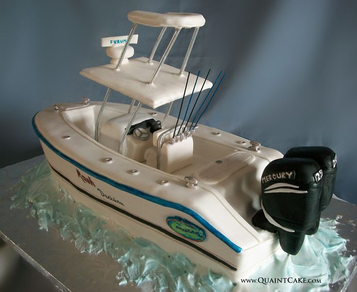 a small boat cake is sitting on a table