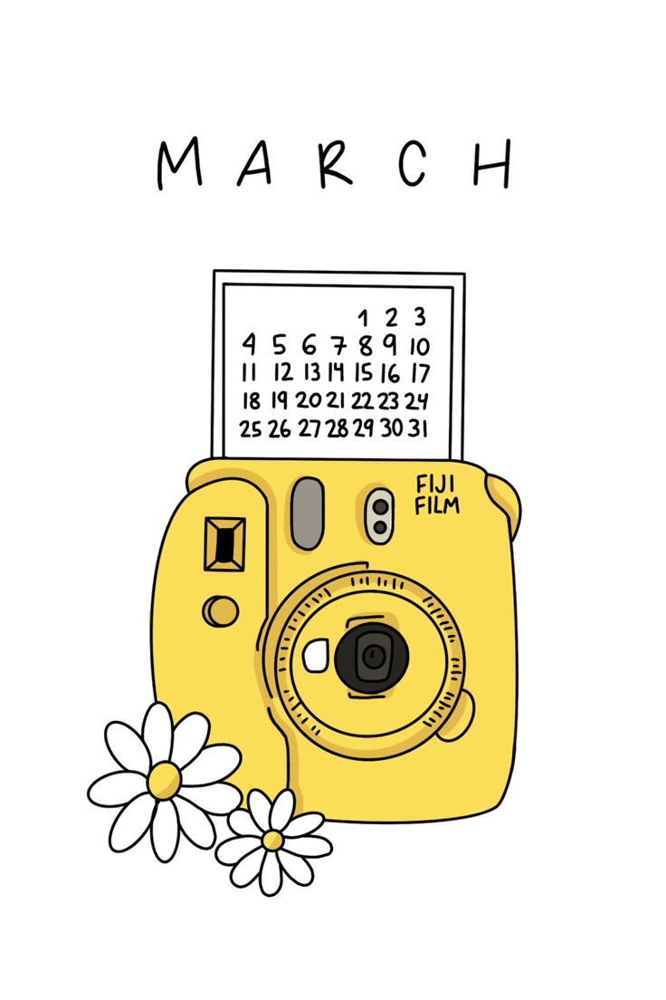 a yellow camera sitting next to a flower