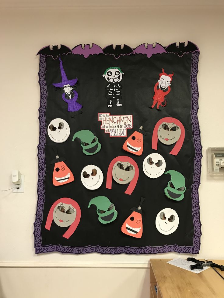 a wall hanging with halloween decorations on it