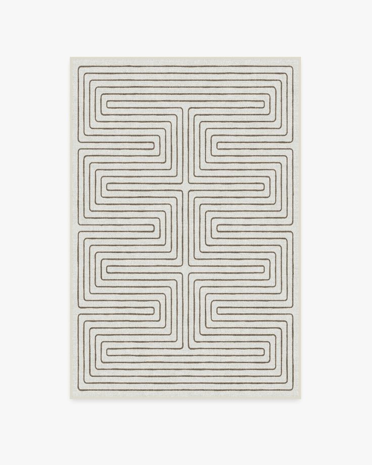 a square white tile with an intertwined design on the front and back side, against a light gray background